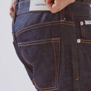 38 Fear Of God - FOG Essentials Raw Indigo Skinny
